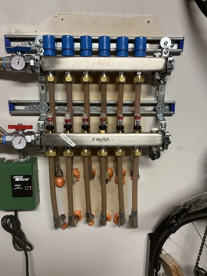 Plumber performing Water Heater Repair at a residential property in Fairview